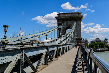 View of old historical Széchenyi Chain Bridge over Danube with clear blue sky in Budapest, Hungary .