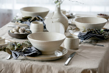 Easter dinner table setting with ceramic tableware