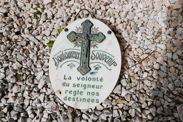 Painful memory, a plaque in a French gaveyard.