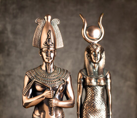 Egyptian Pharaoh Tutankhamun and Isis on a brown background.