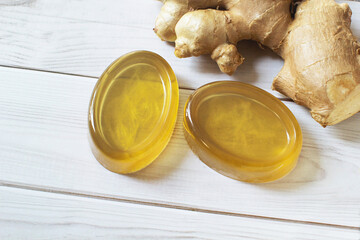 Glycerin hanmade soap., Handmade natural honey ginger soap on white wood background.