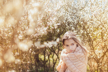 Girl and the blossoming bush at spring