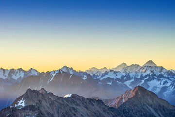 Snowy Greater Caucasus ridge before summer sunrise. View from 