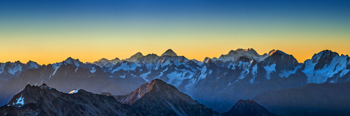 Fototapeta na wymiar Snowy Greater Caucasus ridge before summer sunrise. View from 