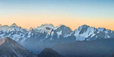 Snowy Greater Caucasus ridge before summer sunrise. View from 