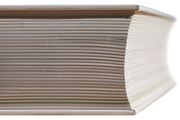 Close view of the side of a closed book with white cover mirrored. Narrow depth of field. Isolated on white