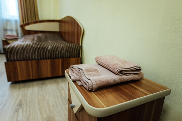 a room in a cheap hotel. minimalistic interior of an economy class hotel room. overnight stay for the traveler. several beds and a table