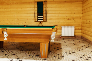 Fototapeta na wymiar pool table in the sauna. recreation and sports entertainment sports entertainment during your vacation. wooden table with green cloth in a private house