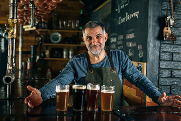 barman serving craft beer in bar
