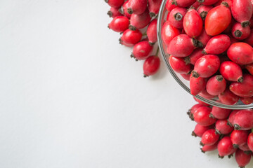 Rose-hips or wild rose berries isolated on a white background.