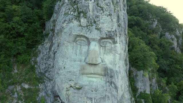 Orsova, Romania, July 30, 2019. Dolly zoom on Decebalus sightseeing, famous Romanian landmark rock sculpture, colossal carving of the last king of Dacia, Mehedinti County. Beautiful places to travel
