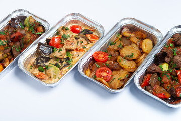 Business lunch in eco plastic container ready for delivery.Top view. Office Lunch boxes with food ready to go. Food takes away. Catering, brakfast.