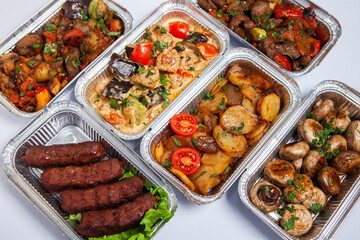 Business lunch in eco plastic container ready for delivery.Top view. Office Lunch boxes with food ready to go. Food takes away. Catering, brakfast.
