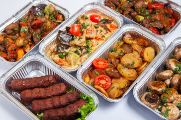 Business lunch in eco plastic container ready for delivery.Top view. Office Lunch boxes with food ready to go. Food takes away. Catering, brakfast.