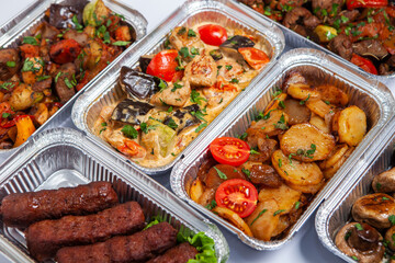 Business lunch in eco plastic container ready for delivery.Top view. Office Lunch boxes with food ready to go. Food takes away. Catering, brakfast.
