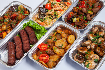 Business lunch in eco plastic container ready for delivery.Top view. Office Lunch boxes with food ready to go. Food takes away. Catering, brakfast.