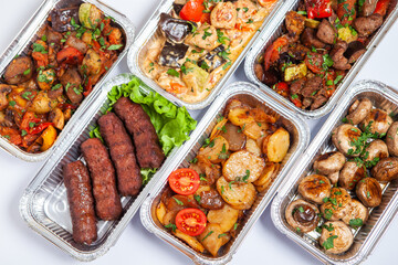 Business lunch in eco plastic container ready for delivery.Top view. Office Lunch boxes with food ready to go. Food takes away. Catering, brakfast.