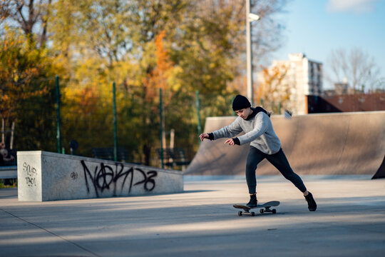 Young female skateboarder in skateboard park
