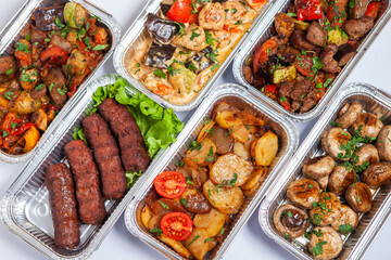 Business lunch in eco plastic container ready for delivery.Top view. Office Lunch boxes with food ready to go. Food takes away. Catering, brakfast.