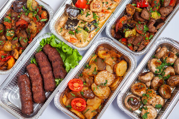 Business lunch in eco plastic container ready for delivery.Top view. Office Lunch boxes with food ready to go. Food takes away. Catering, brakfast.