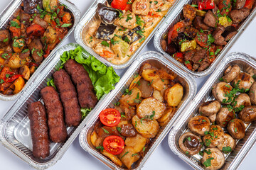 Business lunch in eco plastic container ready for delivery.Top view. Office Lunch boxes with food ready to go. Food takes away. Catering, brakfast.