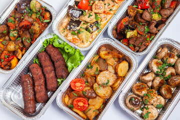 Business lunch in eco plastic container ready for delivery.Top view. Office Lunch boxes with food ready to go. Food takes away. Catering, brakfast.