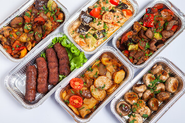 Business lunch in eco plastic container ready for delivery.Top view. Office Lunch boxes with food ready to go. Food takes away. Catering, brakfast.