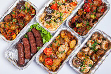 Business lunch in eco plastic container ready for delivery.Top view. Office Lunch boxes with food ready to go. Food takes away. Catering, brakfast.