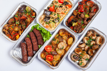 Business lunch in eco plastic container ready for delivery.Top view. Office Lunch boxes with food ready to go. Food takes away. Catering, brakfast.