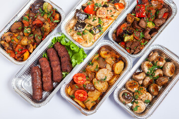 Business lunch in eco plastic container ready for delivery.Top view. Office Lunch boxes with food ready to go. Food takes away. Catering, brakfast.