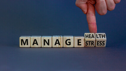 Manage stress and be health symbol. Doctor turns cubes and changes words 'manage stress' to 'manage health'. Beautiful grey background. Psychological, business and manage stress concept. Copy space.