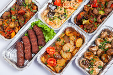 Business lunch in eco plastic container ready for delivery.Top view. Office Lunch boxes with food ready to go. Food takes away. Catering, brakfast.