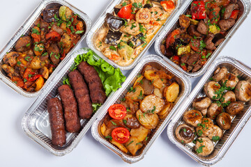 Business lunch in eco plastic container ready for delivery.Top view. Office Lunch boxes with food ready to go. Food takes away. Catering, brakfast.