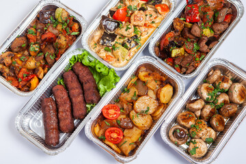Business lunch in eco plastic container ready for delivery.Top view. Office Lunch boxes with food ready to go. Food takes away. Catering, brakfast.