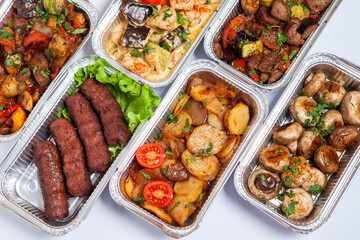 Business lunch in eco plastic container ready for delivery.Top view. Office Lunch boxes with food ready to go. Food takes away. Catering, brakfast.