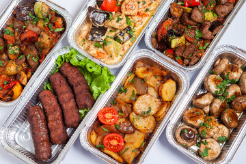 Business lunch in eco plastic container ready for delivery.Top view. Office Lunch boxes with food ready to go. Food takes away. Catering, brakfast.