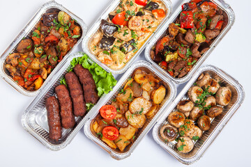 Business lunch in eco plastic container ready for delivery.Top view. Office Lunch boxes with food ready to go. Food takes away. Catering, brakfast.