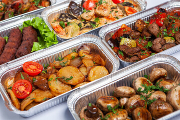 Business lunch in eco plastic container ready for delivery.Top view. Office Lunch boxes with food ready to go. Food takes away. Catering, brakfast.
