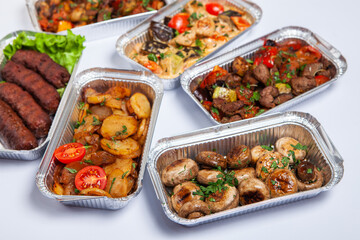 Business lunch in eco plastic container ready for delivery.Top view. Office Lunch boxes with food ready to go. Food takes away. Catering, brakfast.