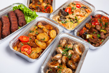 Business lunch in eco plastic container ready for delivery.Top view. Office Lunch boxes with food ready to go. Food takes away. Catering, brakfast.