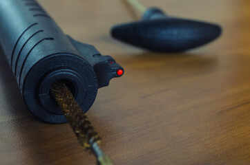 barrel of air rifle and cleaning tool