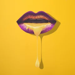 Purple gradient holographic neon lip on yellow background. Gold paint smudges dripping from woman face lips. Golden liquid dripping from sexy lips on beautiful model girl's mouth.  © Stefan