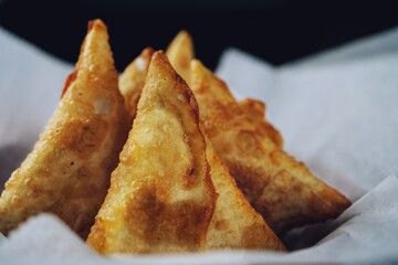 Homemade Samosas - Indian deep fried triangle pastries, selective focus