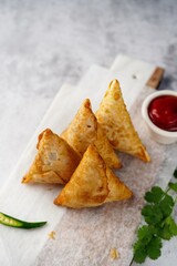 Homemade Samosas - Indian deep fried triangle pastries, selective focus