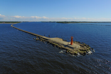 City Riga, Latvia. Lighthouse and mole at river Daugava.