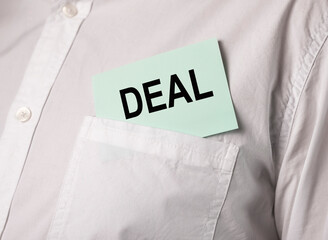 Deal word on paper in pocket of businessman shirt