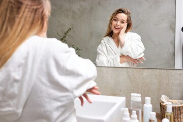 Blonde Caucasian Woman Touching Facial Skin, Enjoying After Shower