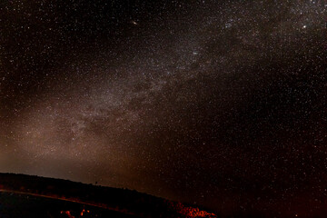 The stars and the milky way light up the Maui sky and the summit of Haleakala
