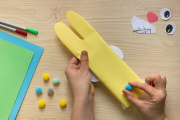do it yourself: Easter sweets decor: wrapping a chocolate bar in the shape of an Easter bunny. Step...