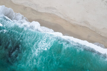 Obraz na płótnie Canvas Aerial view of beach and ocean with waves. Drone view of sea. Galicia, Spain.